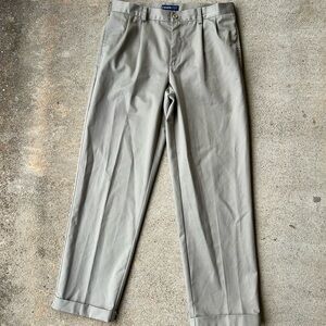 Izod men’s dress kaki color pleated cuffed pants. Size 34x32. Some wear on hem.